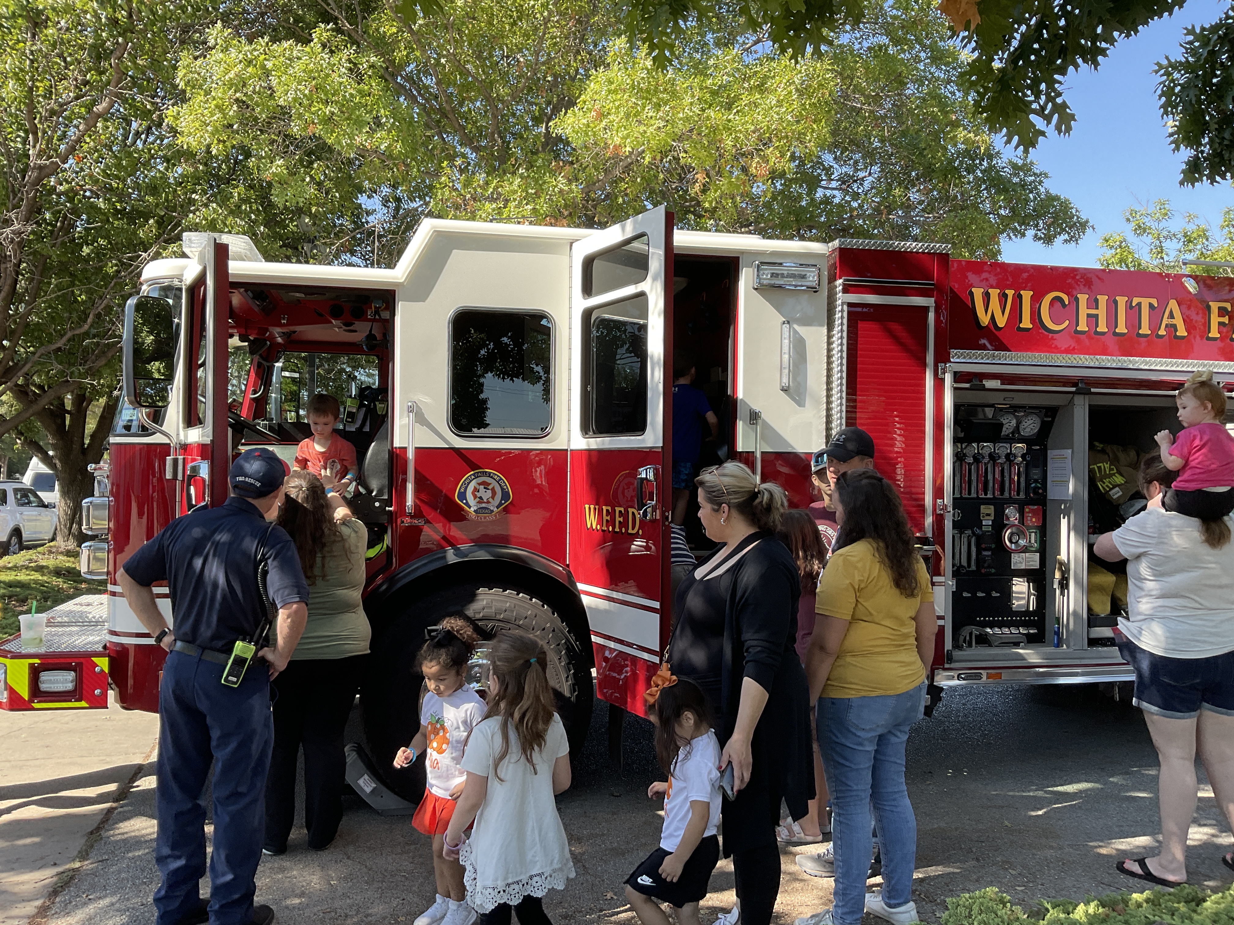 People in line to view a fire engine